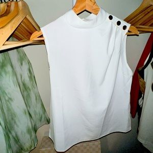 White blouse with gold embellishments